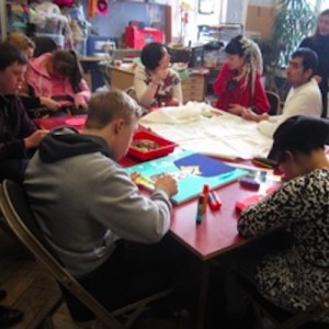 image of the participants sat around a table working on their images