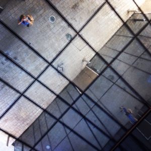 image of a mirrored ceiling reflecting jenny taking a photograph