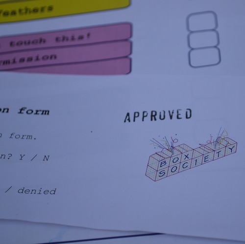 image of forms with 'approved' stamped on one and the 'box society' logo